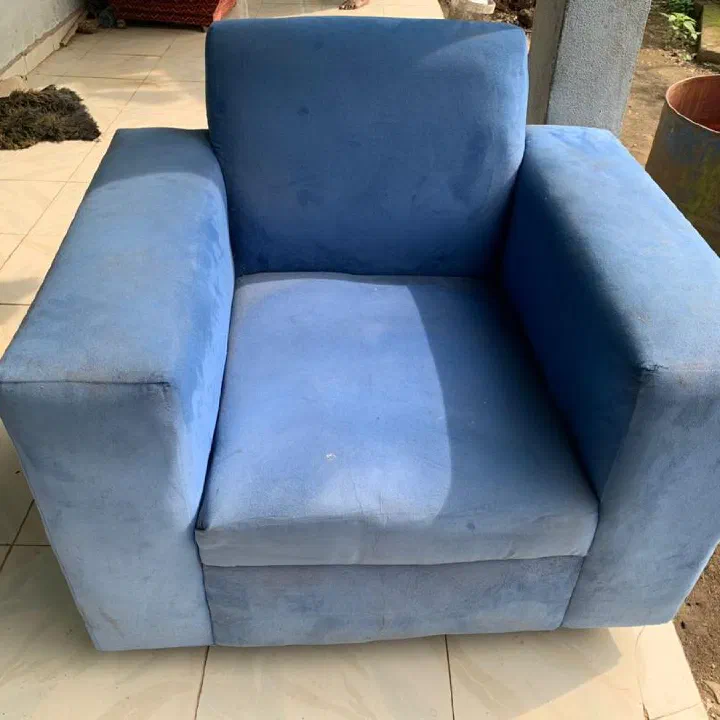 Blue fabric armchair — before cleaning