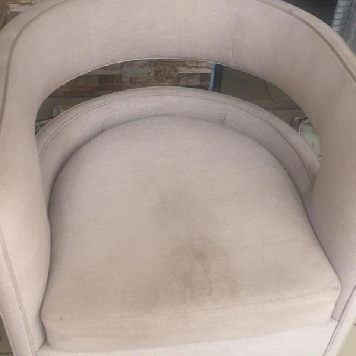 Grey tub chair — before cleaning